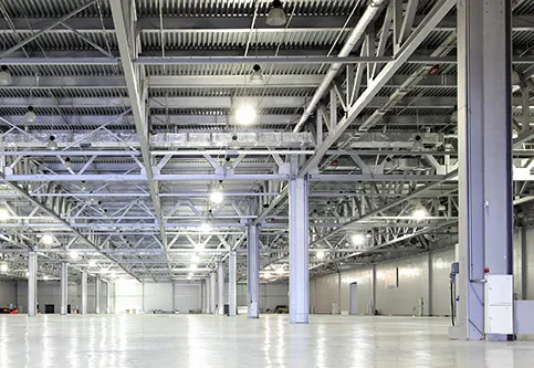 Large industrial warehouse interior with high bay lighting